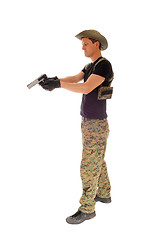 Image showing Soldier aiming his handgun.