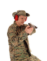 Image showing Soldier pointing a pistol.