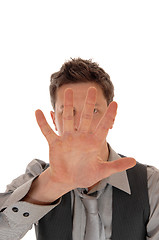 Image showing Man holding hand for face.