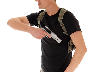 Image showing Soldier pulling his handgun.