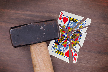 Image showing Hammer with a broken card, king of hearts