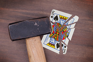 Image showing Hammer with a broken card, king of spades