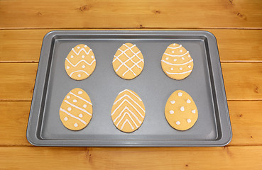 Image showing Frosted Easter egg cookies on a baking tray