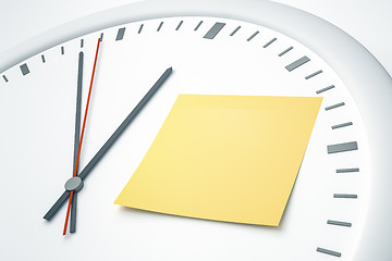 Image showing clock with sticky note