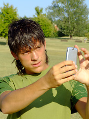 Image showing Young man with mobile