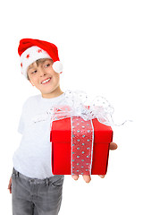 Image showing Boy with present looking sideways