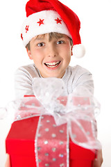 Image showing Festive child holding a present