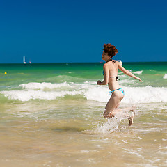 Image showing woman splashing water in the ocean