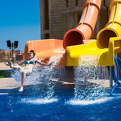 Image showing Happy woman sliding water park.