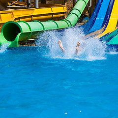 Image showing Happy woman sliding water park.
