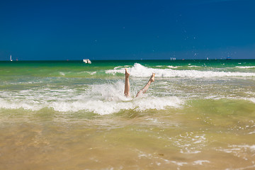 Image showing woman splashing water in the ocean