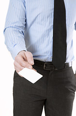 Image showing Man holding business card