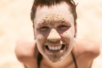 Image showing Beautiful girl with sand on face