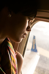 Image showing female airplane passanger enjoying the view