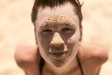 Image showing Beautiful girl with sand on face