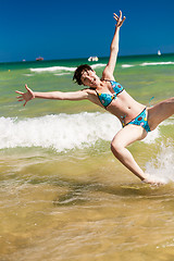 Image showing woman splashing water in the ocean