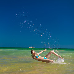 Image showing woman splashing water in the ocean