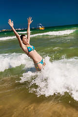 Image showing woman splashing water in the ocean