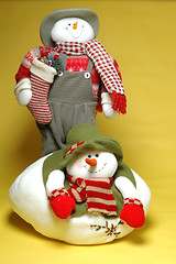 Image showing two snowpeople snowmen with carrot noses