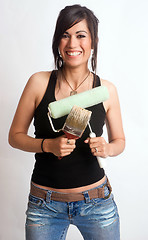 Image showing Hip Woman Holding Painting Tools Brush Roller