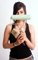 Image showing Hip Fun Attractive Woman Holding Painting Tools Brush Roller