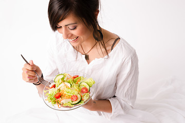 Image showing Healthy Eating Woman Enjoys Raw Food Fresh Green Salad