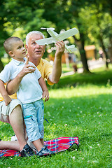 Image showing grandfather and child have fun  in park