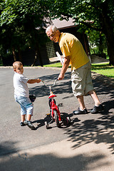 Image showing grandfather and child have fun  in park