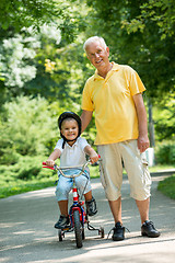 Image showing grandfather and child have fun  in park