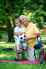 Image showing grandfather and child have fun  in park