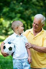 Image showing grandfather and child have fun  in park