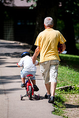 Image showing grandfather and child have fun  in park