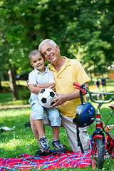 Image showing grandfather and child have fun  in park