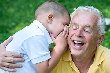 Image showing grandfather and child have fun  in park