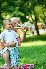 Image showing grandfather and child have fun  in park