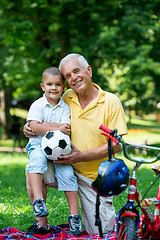 Image showing grandfather and child have fun  in park