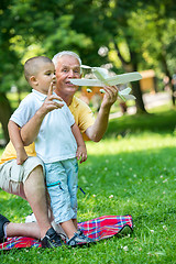 Image showing grandfather and child have fun  in park