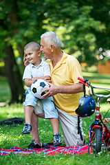 Image showing grandfather and child have fun  in park