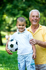 Image showing grandfather and child have fun  in park