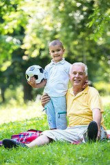 Image showing grandfather and child have fun  in park