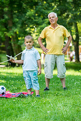 Image showing grandfather and child have fun  in park