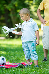 Image showing grandfather and child have fun  in park