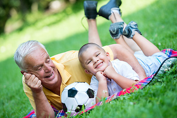 Image showing grandfather and child have fun  in park