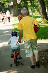 Image showing grandfather and child have fun  in park