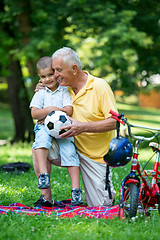 Image showing grandfather and child have fun  in park