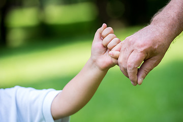 Image showing grandfather and child have fun  in park