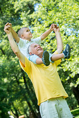 Image showing grandfather and child have fun  in park