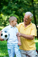 Image showing grandfather and child have fun  in park