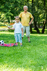 Image showing grandfather and child have fun  in park