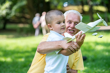 Image showing grandfather and child have fun  in park